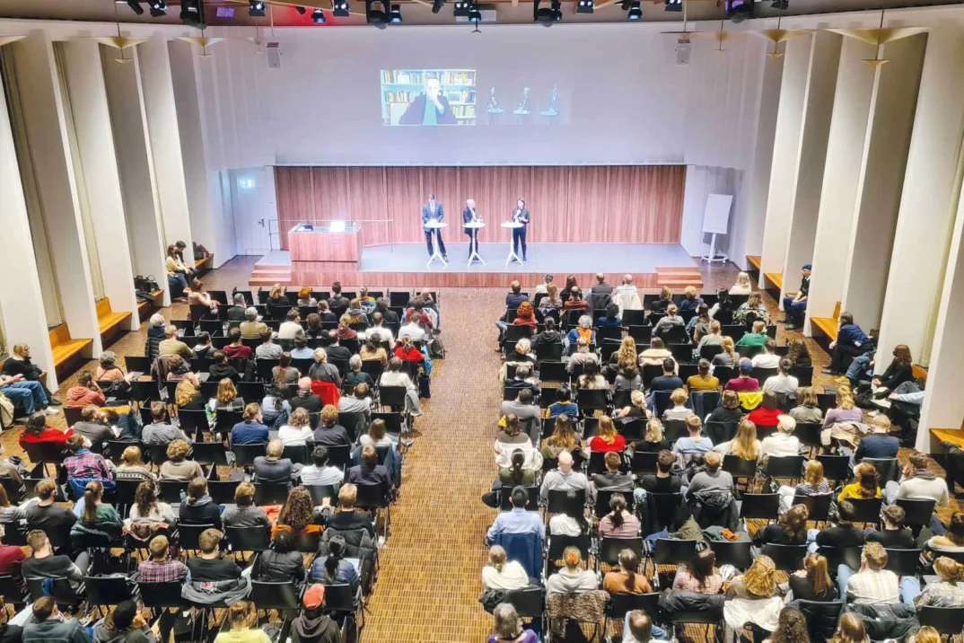 Panel discussion with audience at the University of Basel