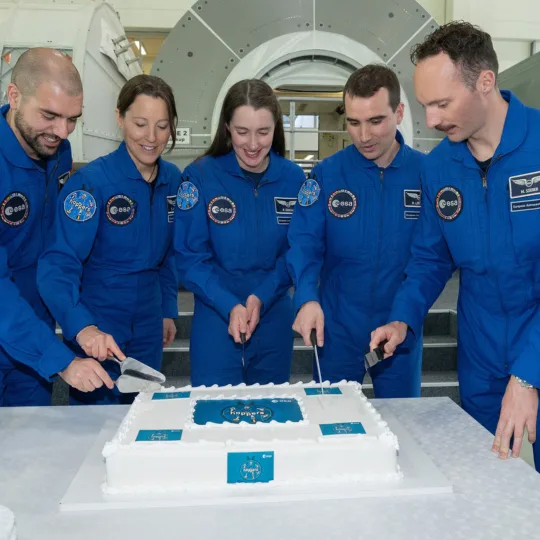 The five ESA astronauts cut their cake together to mark the completion of their basic training.