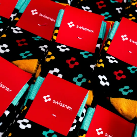 Coloured socks with the Swissnex logo.