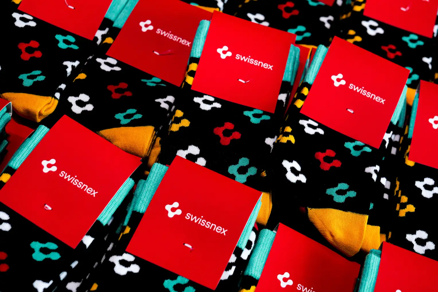 Coloured socks with the Swissnex logo.