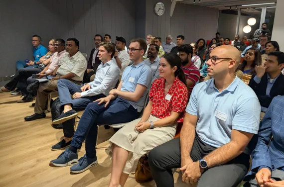 A room full of seated people