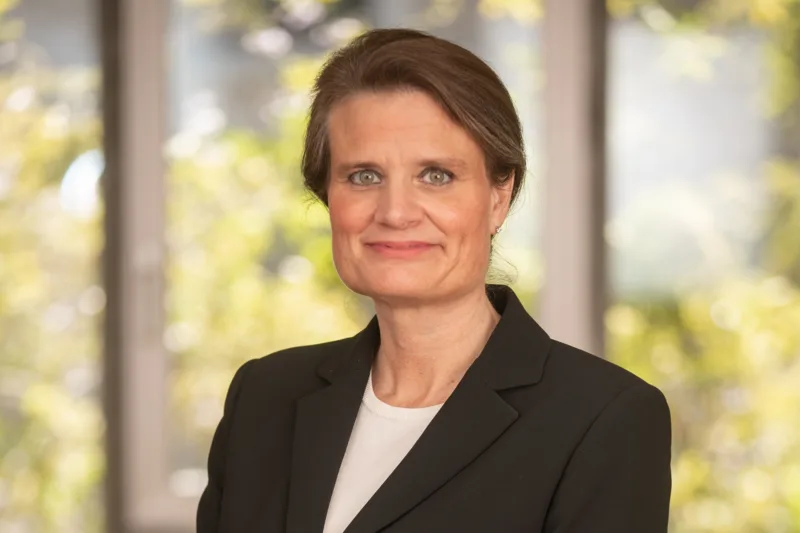 Portrait of a woman in a blazer.