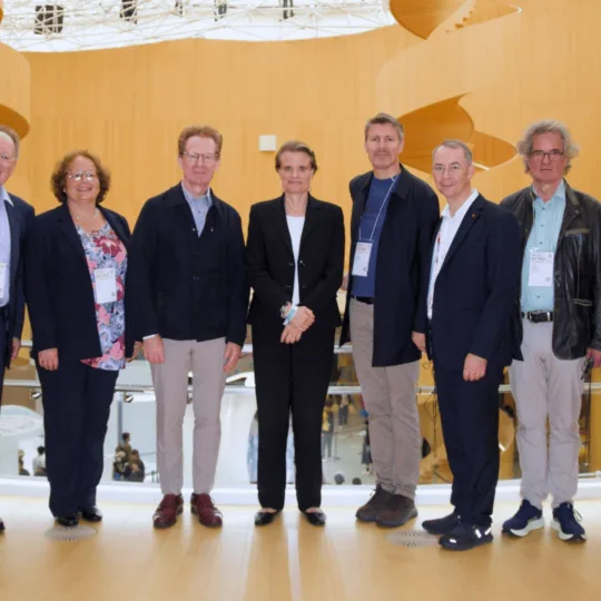 A group of people looking at the camera for a photograph.