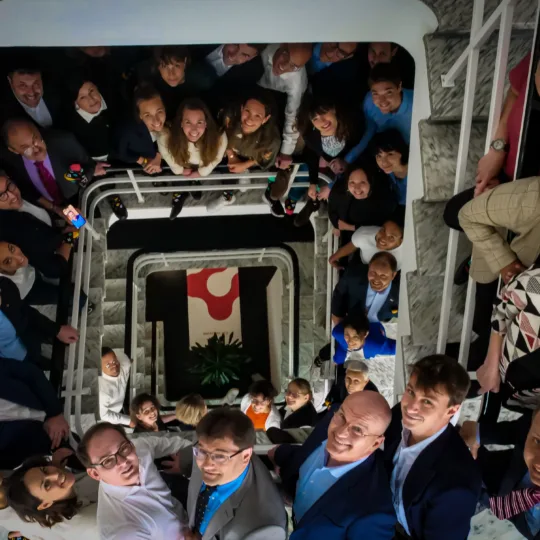 A group photo in a stairwell.