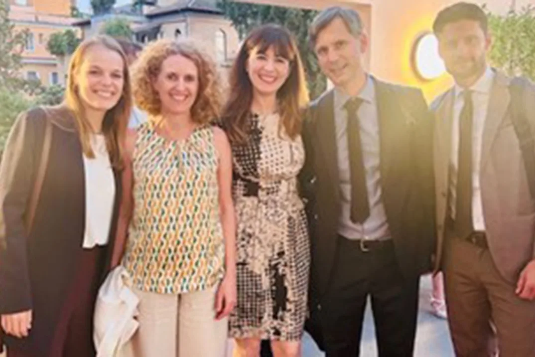 Three women and two men in a group photo.