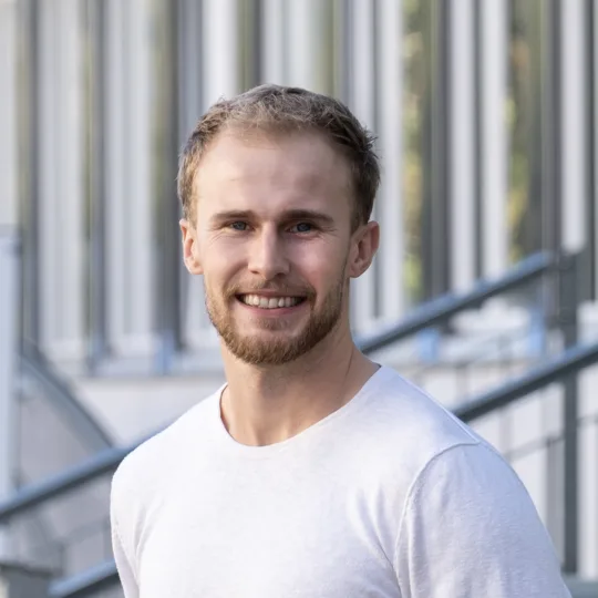 Man standing in front of a building