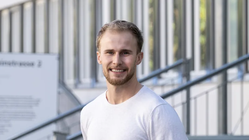 Man standing in front of a building